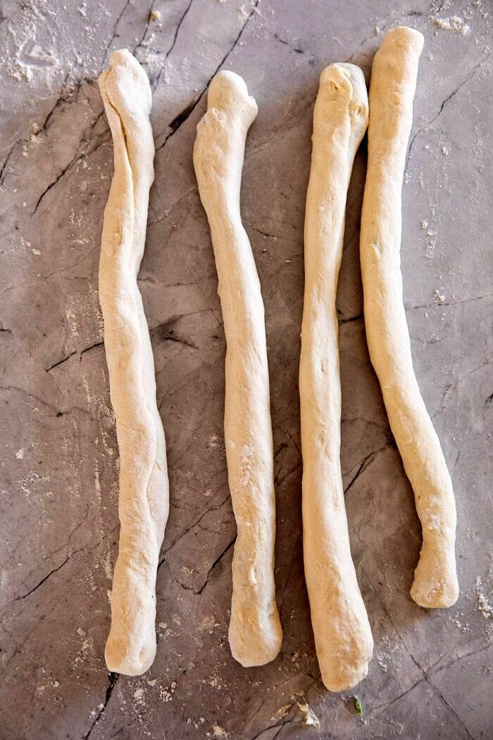 Spinach and Artichoke Stuffed Soft Pretzel ropes before twisting into pretzels