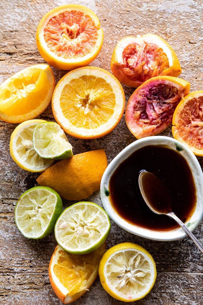 Pomegranate Ponzu Sauce with juiced oranges on table