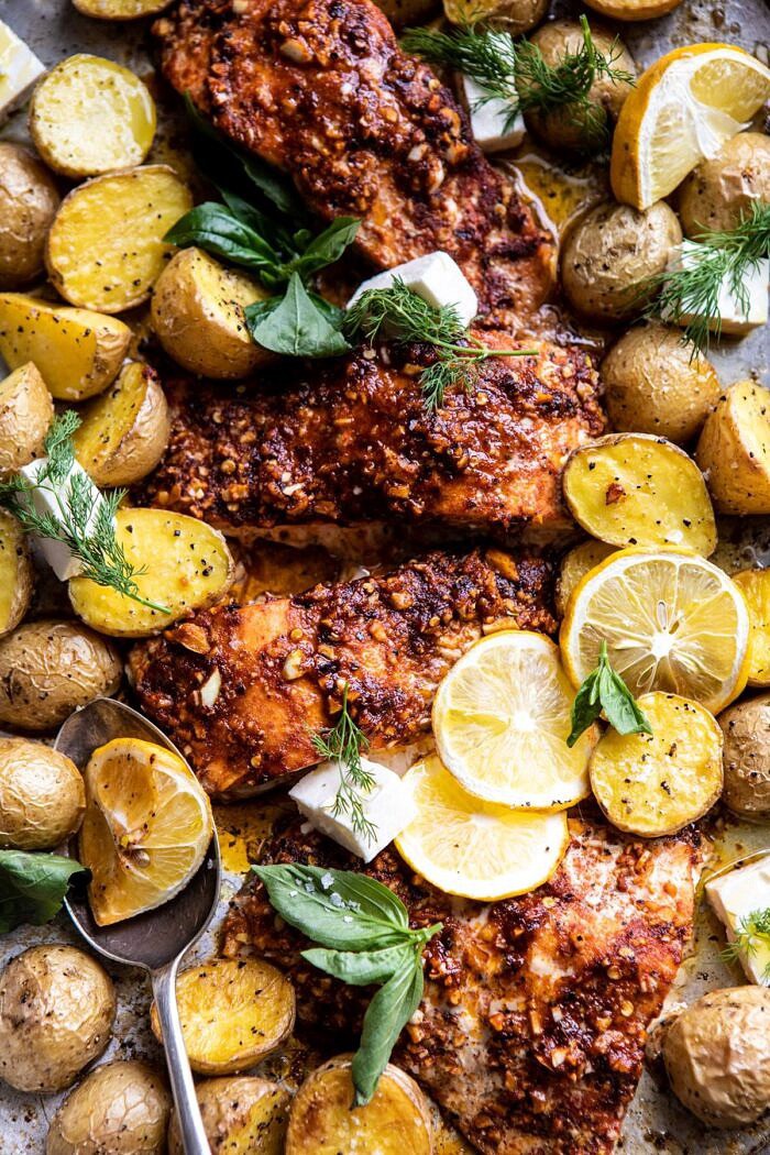 Sheet Pan Blackened Salmon Bowl with Potatoes and Avocado Goddess Sauce | halfbakedharvest.com #sheetpan #healthyrecipes #easyrecipes #bowlfood #salmon close up photo on Sheet Pan Blackened Salmon Bowl with Potatoes and Avocado Goddess Sauce on baking sheet