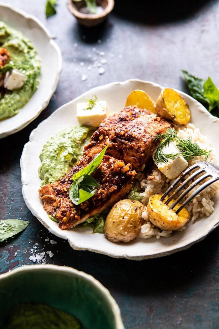 Sheet Pan Blackened Salmon Bowl with Potatoes and Avocado Goddess Sauce | halfbakedharvest.com #sheetpan #healthyrecipes #easyrecipes #bowlfood #salmon side angle photo of Sheet Pan Blackened Salmon Bowl with Potatoes and Avocado Goddess Sauce
