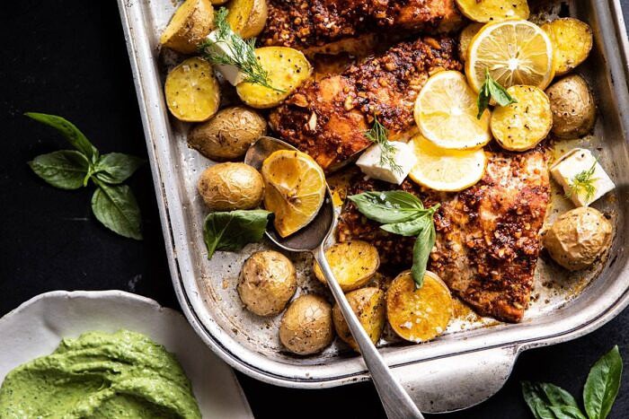 Sheet Pan Blackened Salmon Bowl with Potatoes and Avocado Goddess Sauce | halfbakedharvest.com #shetpan #healthyrecipes #easyrecipes #bowlfood #salmon horizontal photo of Sheet Pan Blackened Salmon Bowl with Potatoes on baking sheet