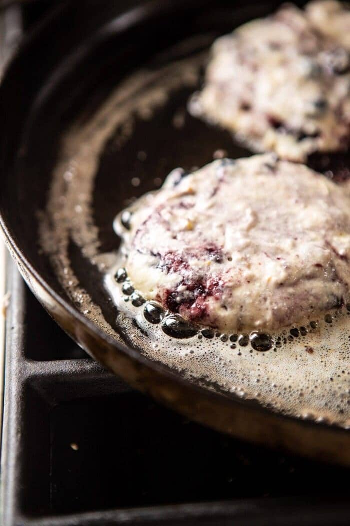 Blueberry Lemon Ricotta Pancakes | halfbakedharvest.com #blueberrypancakes #pancakes #brunch #breakfast #lemon Blueberry Lemon Ricotta Pancakes on skillet cooking