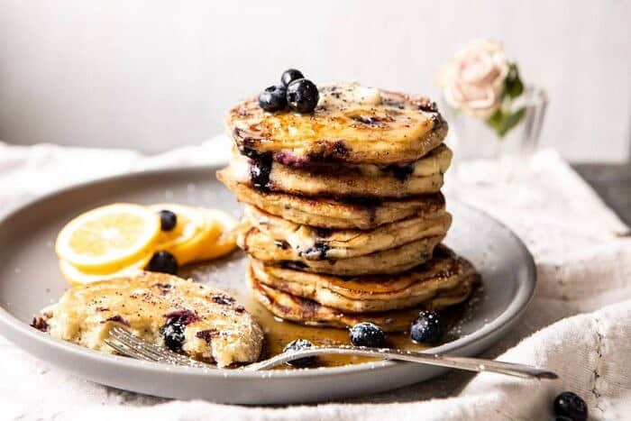 Blueberry Lemon Ricotta Pancakes | halfbakedharvest.com #blueberrypancakes #pancakes #brunch #breakfast #lemon horizontal photo of Blueberry Lemon Ricotta Pancakes