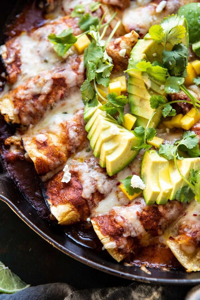 side angle close up photo of Chipotle Cheddar Cauliflower Black Bean Enchiladas