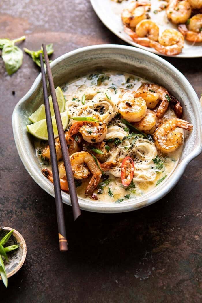 Saucy Garlic Butter Shrimp with Coconut Milk and Rice Noodles | halfbakedharvest.com #shrimp #easyrecipes #healthy #seafood #thairecipes #asian side angled photo of Saucy Garlic Butter Shrimp with Coconut Milk and Rice Noodles