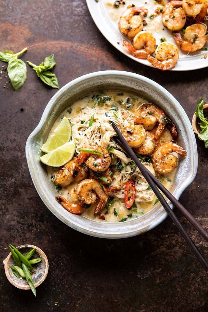 Saucy Garlic Butter Shrimp with Coconut Milk and Rice Noodles | halfbakedharvest.com #shrimp #easyrecipes #healthy #seafood #thairecipes #asian overhead photo of Saucy Garlic Butter Shrimp with Coconut Milk and Rice Noodles with chopsticks in bowl