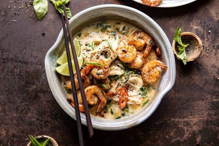 Saucy Garlic Butter Shrimp with Coconut Milk and Rice Noodles | halfbakedharvest.com #shrimp #easyrecipes #healthy #seafood #thairecipes #asian horizontal photo of Saucy Garlic Butter Shrimp with Coconut Milk and Rice Noodles