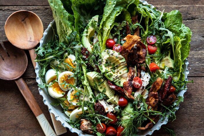 horizontal photo of Sun-Dried Tomato Chicken and Avocado Cobb Salad with Tahini Ranch 