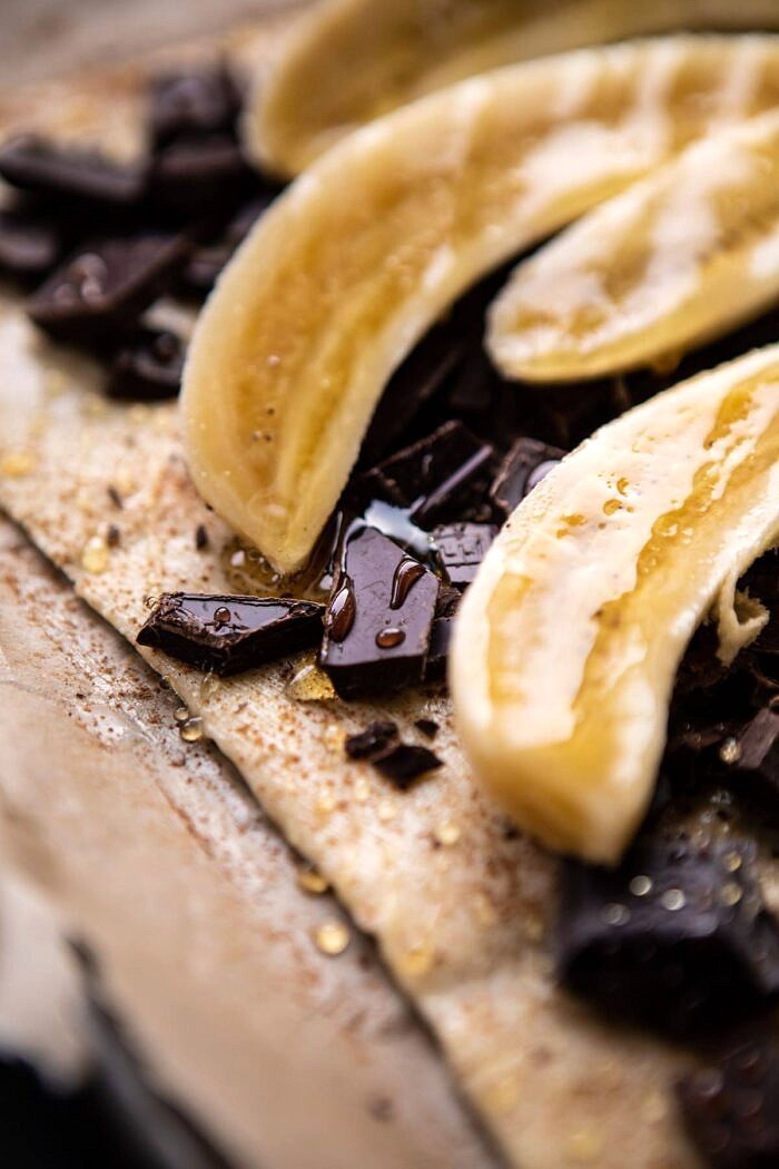 Warm Chocolate Banana Galette | halfbakedharvest.com #banana #chocolate #dessert #easyrecipes #chocolaterecipes #baking Warm Chocolate Banana Galette before baking with bananas on top