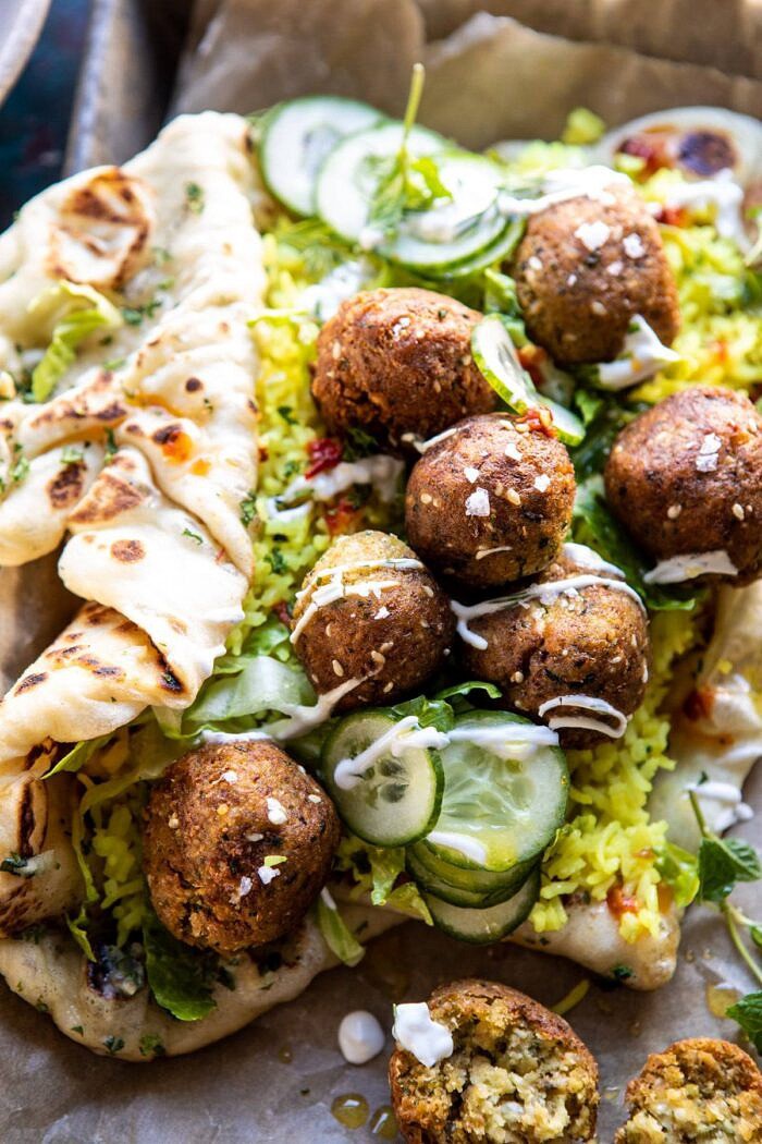 Falafel Naan Wraps with Golden Rice and Special Sauce | halfbakedharvest.com #falafel #wraps #middleeastern #vegan close up photo of Falafel Naan Wraps with Golden Rice and Special Sauce