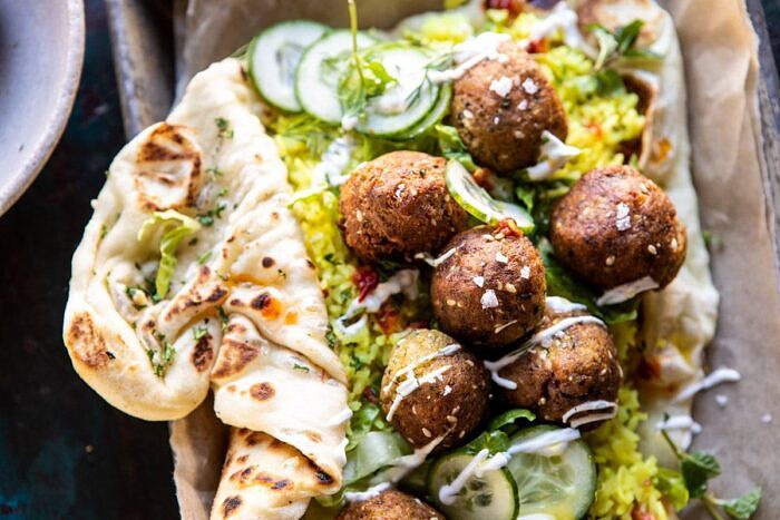 Falafel Naan Wraps with Golden Rice and Special Sauce | halfbakedharvest.com #falafel #wraps #middleeastern #vegan horizontal photo of Falafel Naan Wraps with Golden Rice and Special Sauce