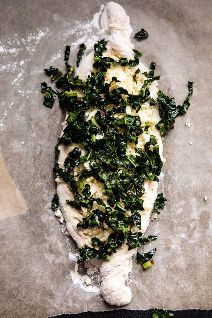 Khachapuri (Georgian Cheese Bread) with Kale and Herb Sauce | halfbakedharvest.com #pizza #easyrecipes #cheese #bread Khachapuri (Georgian Cheese Bread) with Kale before baking