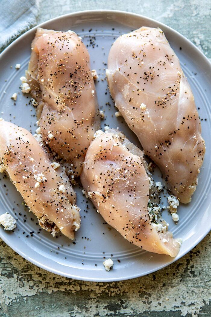 One Skillet Goat Cheese Stuffed Chicken and Orzo | halfbakedharvest.com #skilletchicken #skilletrecipes #easyrecipes #dinner raw chicken before cooking on plate