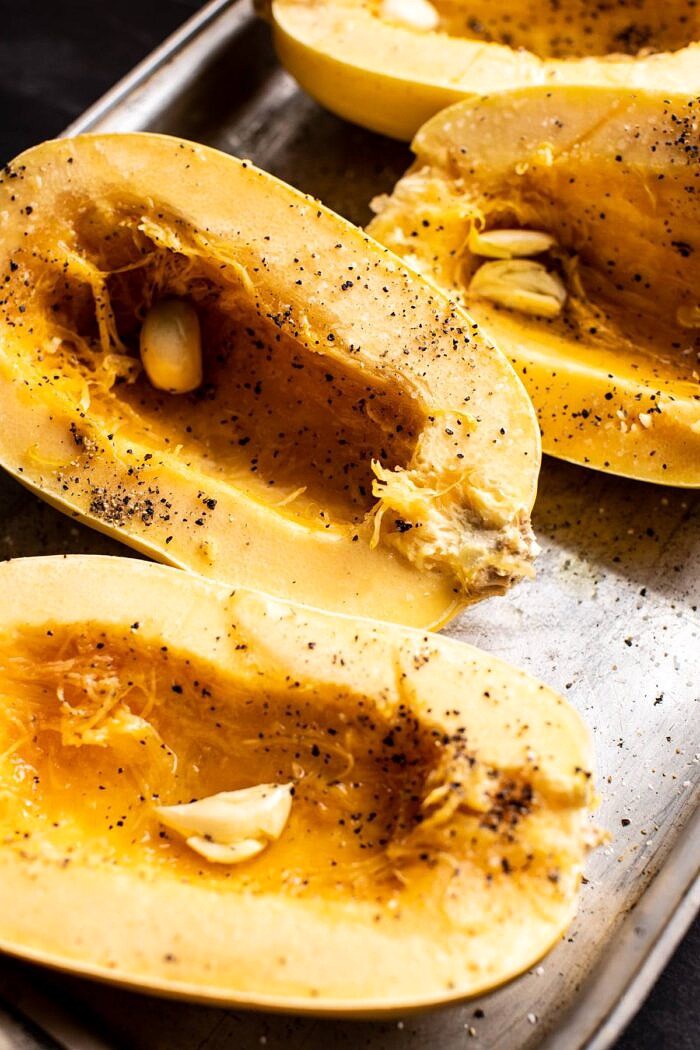 Spicy Tomato Parmesan Stuffed Spaghetti Squash | halfbakedharvest.com #spaghettisquash #healthyrecipes #easyrecipes #dinner spaghetti squash before baking