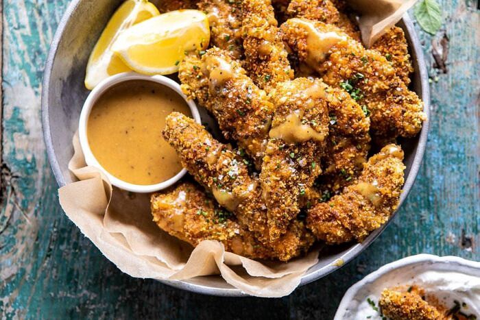 Baked Black Pepper Ranch Chicken Fingers with Honey Mustard | halfbakedharvest.com #chicken #easyrecipes #dinner #chickenfingers horizontal photo of Baked Black Pepper Ranch Chicken Fingers with Honey Mustard