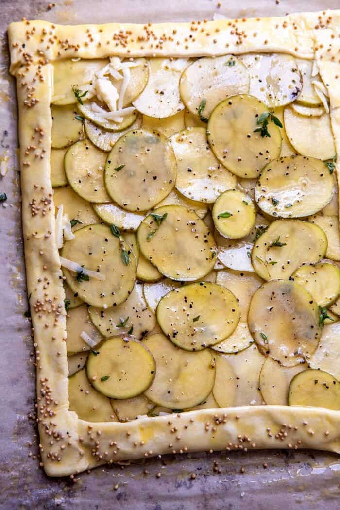 Cheesy Potato Chive Galette | halfbakedharvest.com #potato #cheese #easyrecipes #appetizer #Easter #spring overhead photo of Cheesy Potato Chive Galette before baking