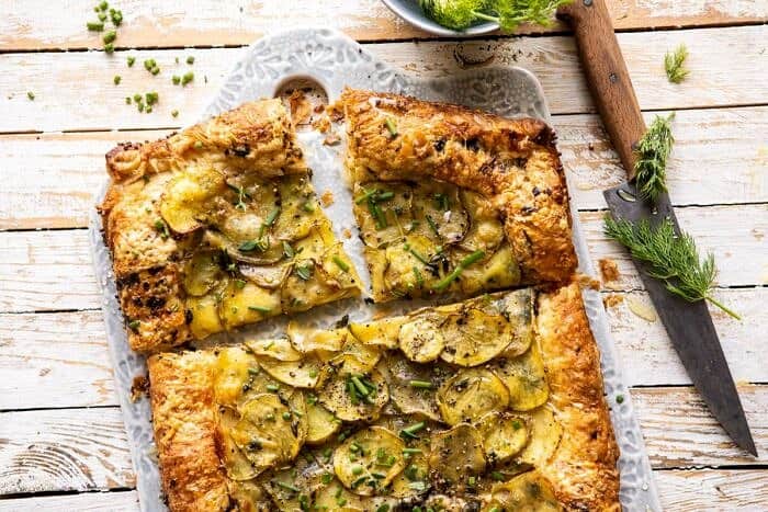 Cheesy Potato Chive Galette | halfbakedharvest.com #potato #cheese #easyrecipes #appetizer #Easter #spring horizontal photo of Cheesy Potato Chive Galette