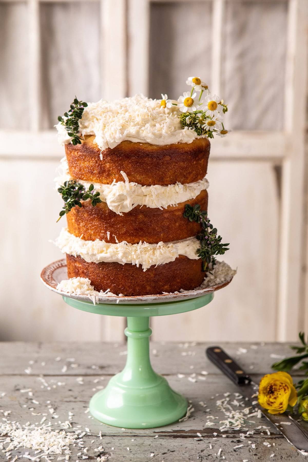 Lemon Coconut Naked Cake with Whipped Vanilla Buttercream | halfbakedharvest.com #coconutcake #springrecipes #easter #cake #layercake