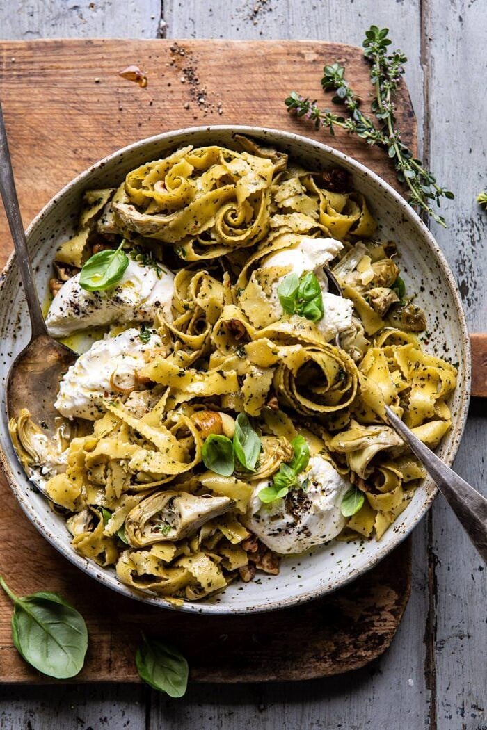 overhead photo of Roasted Lemon Artichoke and Browned Butter Pasta with serving spoons in bowl 