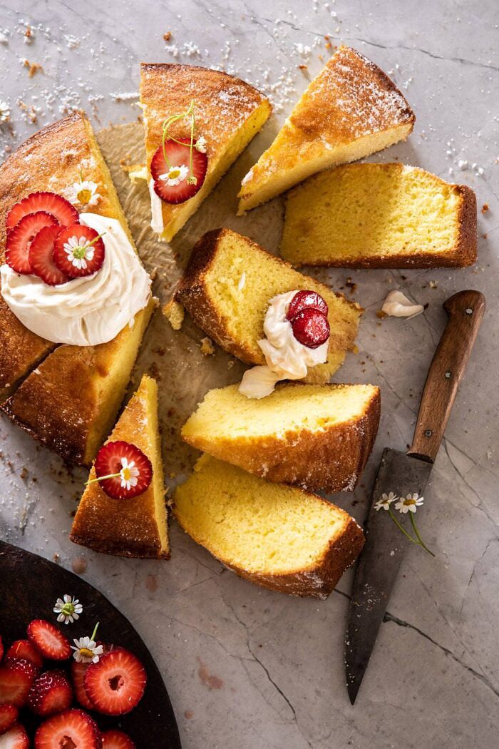 Strawberry Chamomile Olive Oil Cake with Honeyed Ricotta | halfbakedharvest.com #cake #dessert #springrecipes #Easter #strawberry overhead close up photo of Strawberry Chamomile Olive Oil Cake with Honeyed Ricotta