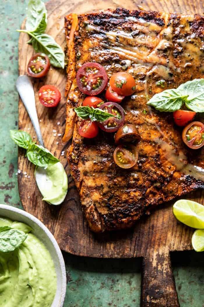 Honey Mustard Grilled Salmon with Avocado Basil Sauce | halfbakedharvest.com #grilling #salmon #summer #healthyrecipes overhead close up photo of Honey Mustard Grilled Salmon with Avocado Basil Sauce