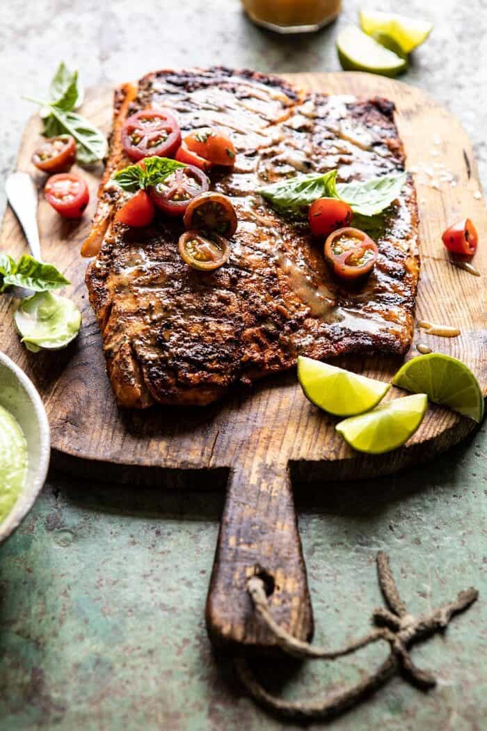 Honey Mustard Grilled Salmon with Avocado Basil Sauce | halfbakedharvest.com #grilling #salmon #summer #healthyrecipes side angled photo of Honey Mustard Grilled Salmon with Avocado Basil Sauce