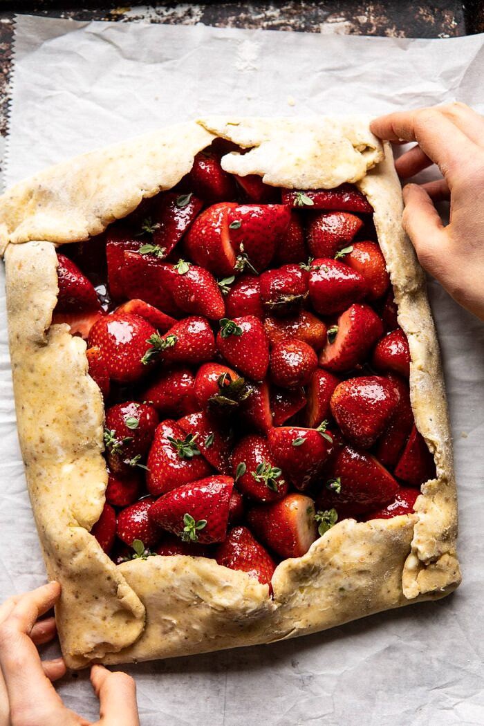 Jammy Strawberry Galette | halfbakedharvest.com #strawberries #tart #summer #fruit #springrecipes overhead photo of Jammy Strawberry Galette before baking