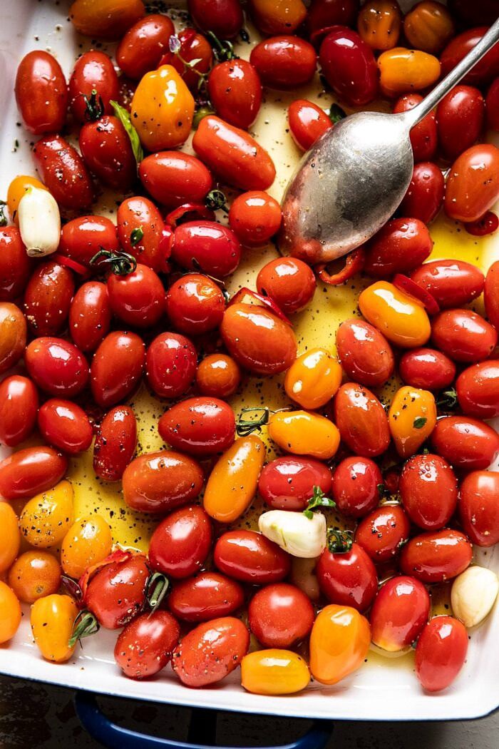 Roasted Caprese Burrata Sliders | halfbakedharvest.com #summerrecipes #appetizer #mothersday #burrata tomatoes in pan before roasting