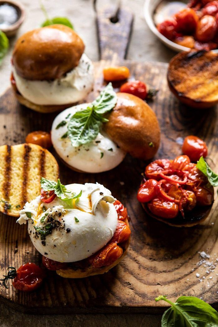 Roasted Caprese Burrata Sliders | halfbakedharvest.com #summerrecipes #appetizer #mothersday #burrata side angled photo of Roasted Caprese Burrata Sliders