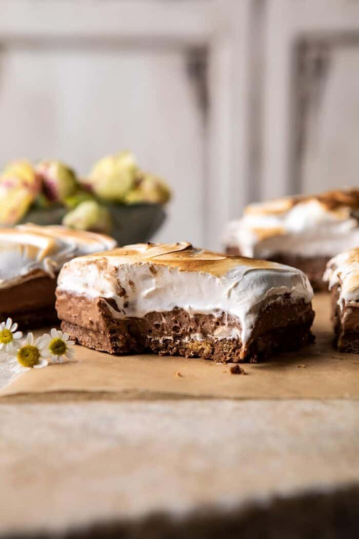 S'mores Chocolate Mousse Bars | halfbakedharvest.com #smores #dessert #chocolate #summerrecipes front on photo of S'mores Chocolate Mousse Bar with bite taken out of bar