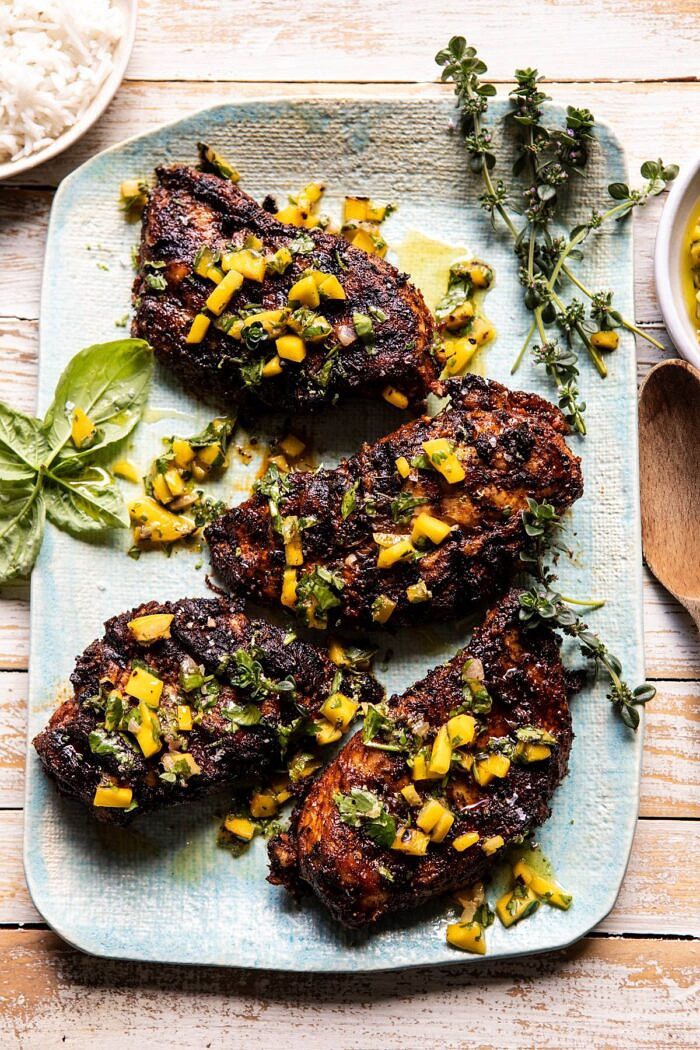 Tropical Jerk Grilled Chicken with Charred Mango Salsa Verde | halfbakedharvest.com #chicken #grilled #easyrecipe #healthy overhead photo of Tropical Jerk Grilled Chicken with Charred Mango Salsa Verde