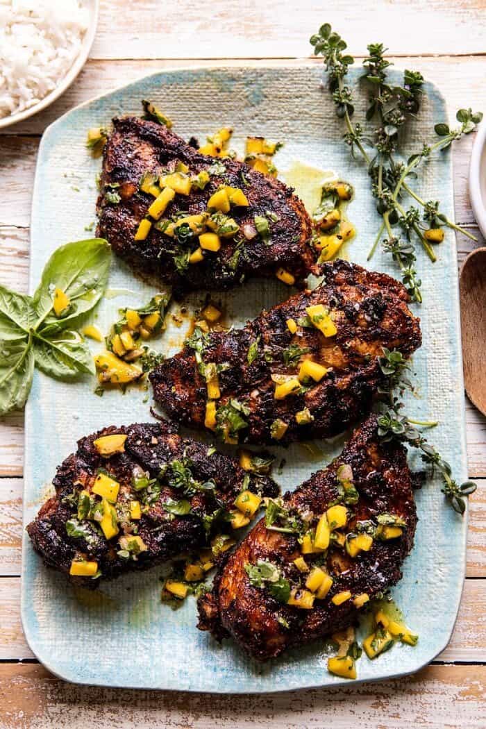 Tropical Jerk Grilled Chicken with Charred Mango Salsa Verde | halfbakedharvest.com #chicken #grilled #easyrecipe #healthy overhead photo of Tropical Jerk Grilled Chicken