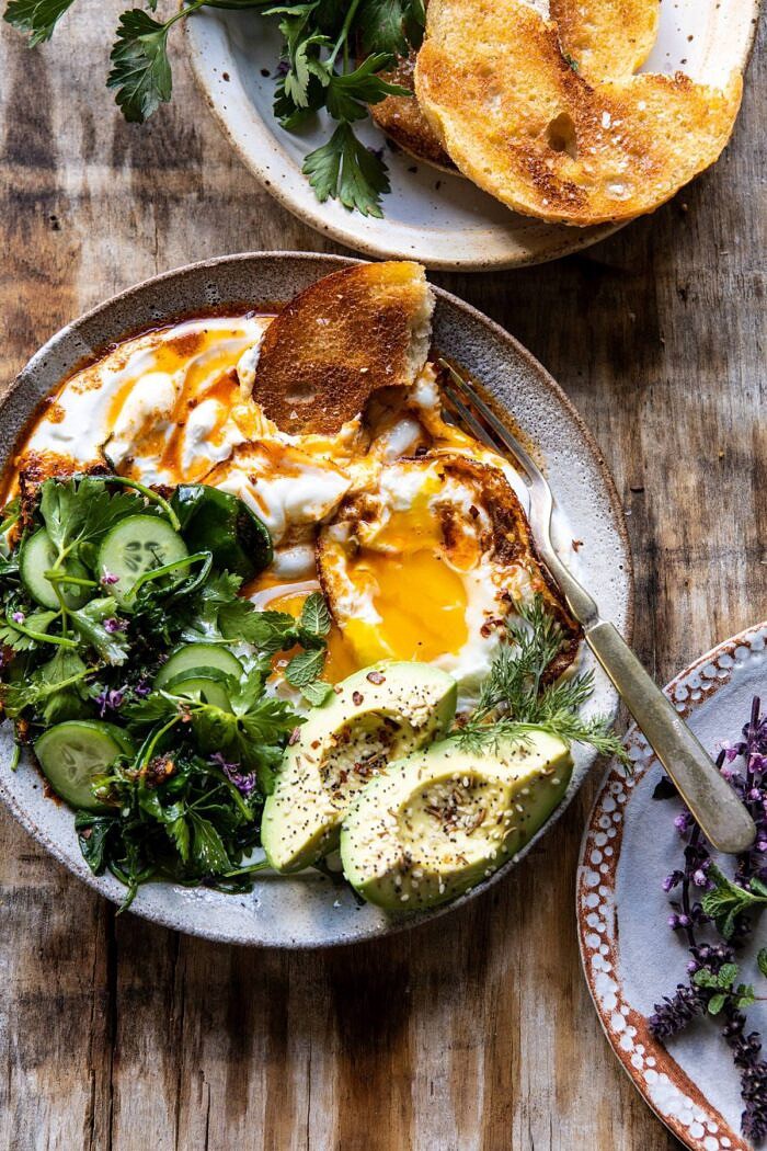 overhead photo of Turkish Eggs with eggs broken in bowl 
