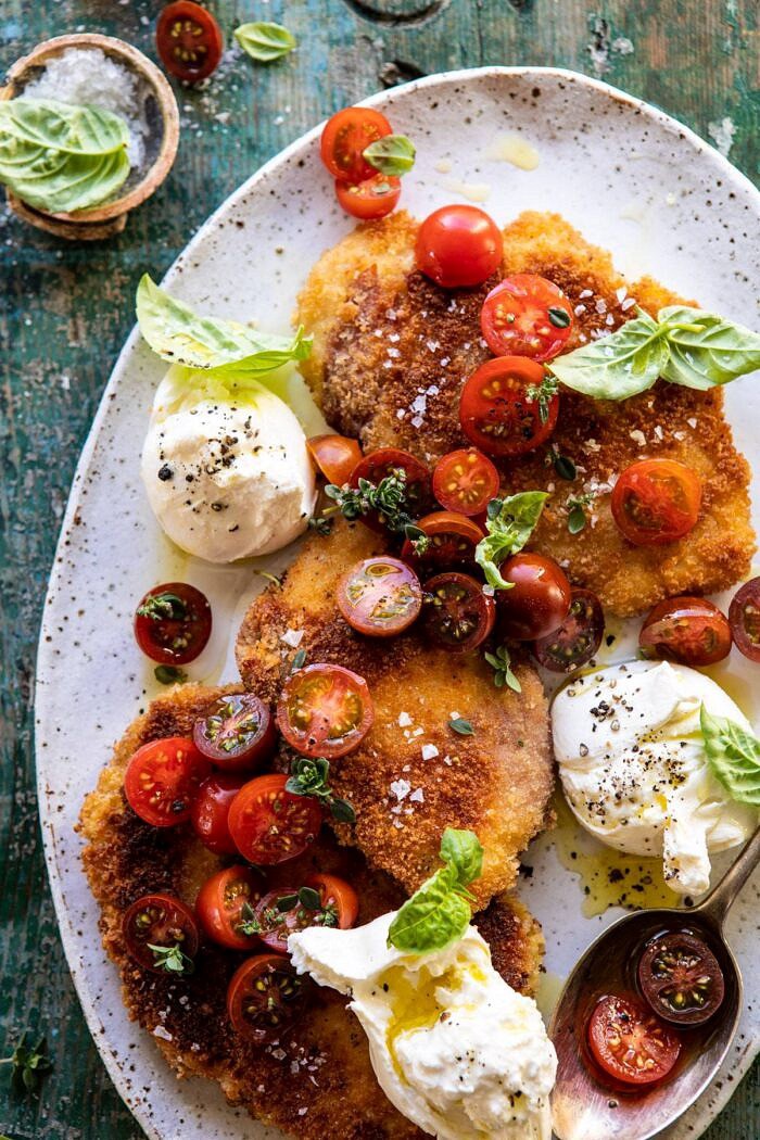 Basil Chicken Saltimbocca with Marinated Tomatoes and Burrata | halfbakedharvest.com #chicken #tomatoes #basil #summerrecipes overhead close up photo of Basil Chicken Saltimbocca with Marinated Tomatoes and Burrata on platter