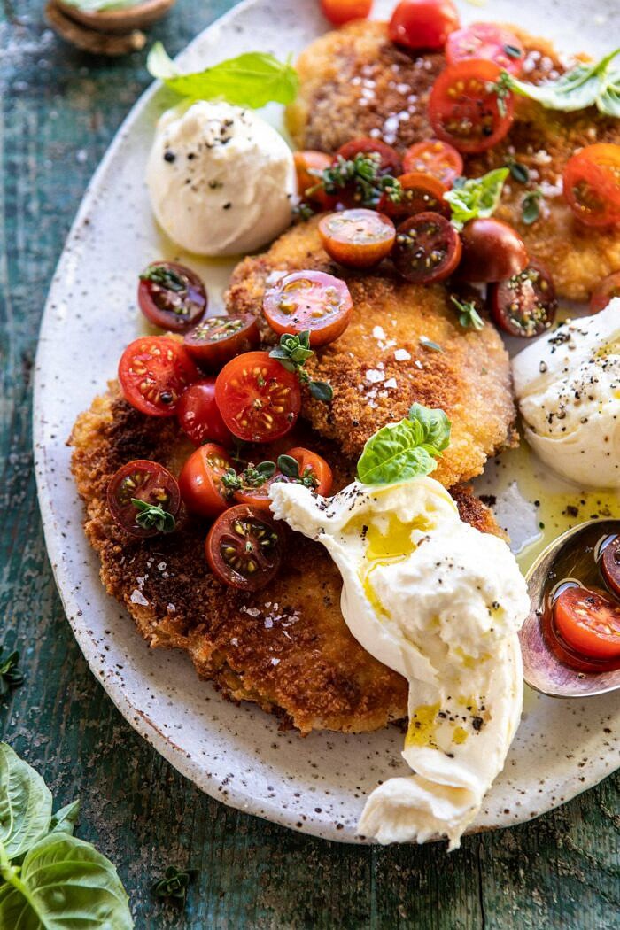 Basil Chicken Saltimbocca with Marinated Tomatoes and Burrata | halfbakedharvest.com #chicken #tomatoes #basil #summerrecipes close up side angle photo of Basil Chicken Saltimbocca with Marinated Tomatoes and Burrata