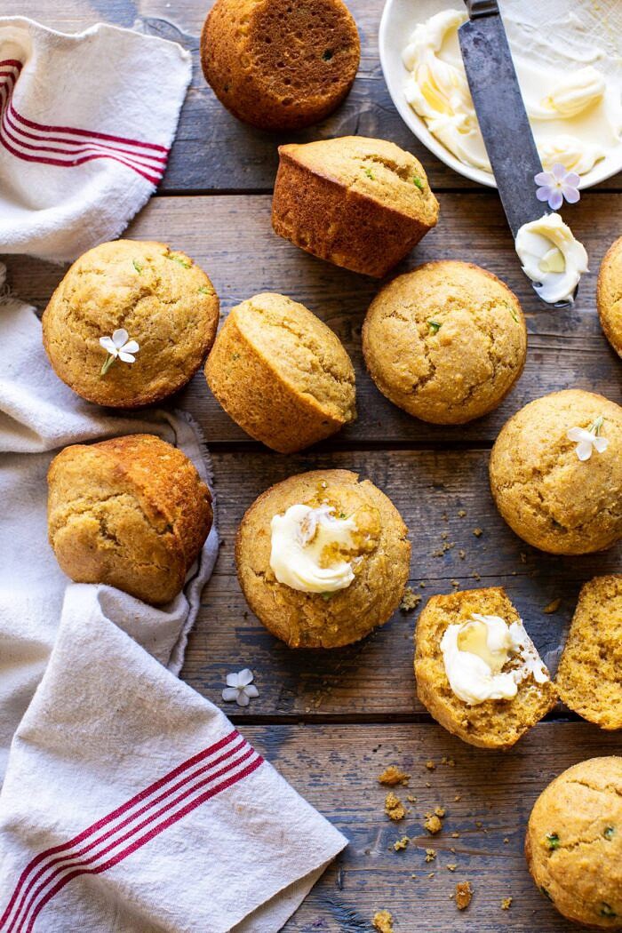 Browned Butter Jalapeño Cornbread Muffins | halfbakedharvest.com #cornbread #easyrecipes #brownedbutter overhead photo of Browned Butter Jalapeño Cornbread Muffins with butter and honey on muffin
