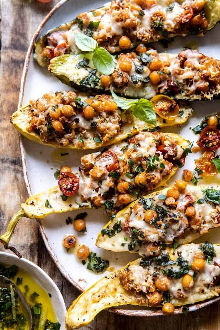Spicy Chickpea and Cheese Stuffed Zucchini | halfbakedharvest.com #healthy #easyrecipes #summerrecipes #zucchini overhead close up photo of Spicy Chickpea and Cheese Stuffed Zucchini