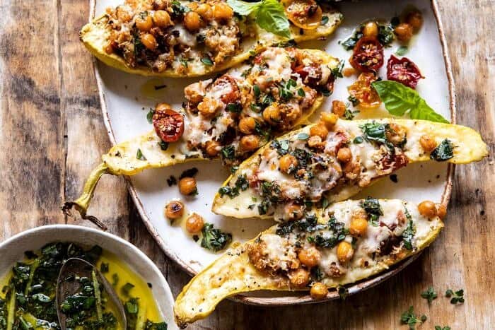 Spicy Chickpea and Cheese Stuffed Zucchini | halfbakedharvest.com #healthy #easyrecipes #summerrecipes #zucchini horizontal photo of Spicy Chickpea and Cheese Stuffed Zucchini