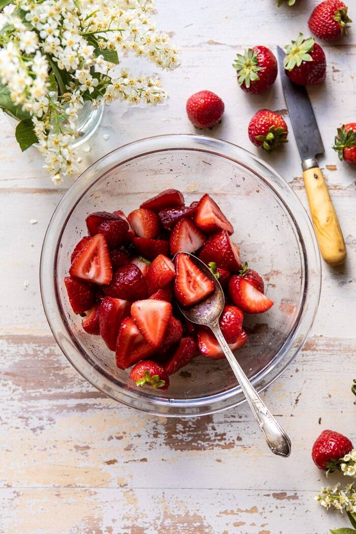 The Best Strawberry Shortcakes | halfbakedharvest.com #shortcakes #strawberries #summer #strawberry overhead photo of macerated strawberries in bowl