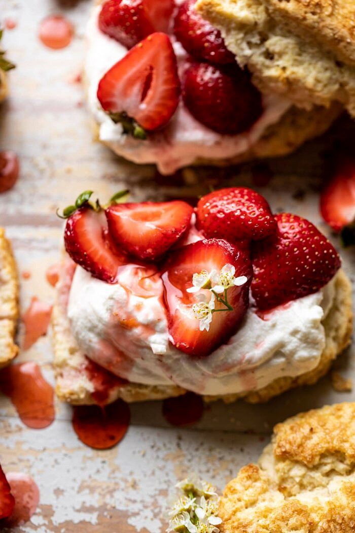 The Best Strawberry Shortcakes | halfbakedharvest.com #shortcakes #strawberries #summer #strawberry side angled close up photo of The Best Strawberry Shortcake