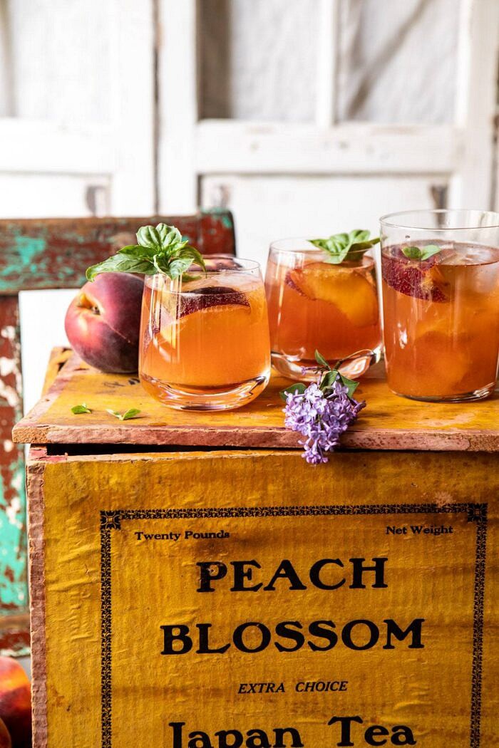 Balsamic Peach Spritz | halfbakedharvest.com #peach #peaches #wine #cocktail #drinks side angled photo of Balsamic Peach Spritz