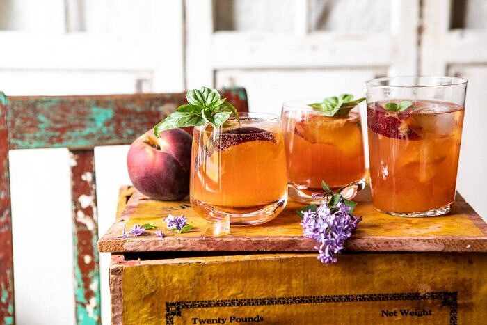 Balsamic Peach Spritz | halfbakedharvest.com #peach #peaches #wine #cocktail #drinks horizontal front on photo of Balsamic Peach Spritz
