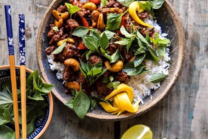 Better Than Takeout Sweet Thai Basil Chicken | halfbakedharvest.com #easyrecipes #20minutes #thaichicken #ricebowl #healthy horizontal photo of Better Than Takeout Sweet Thai Basil Chicken