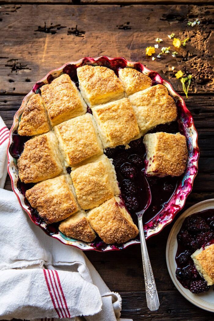 Blackberry Lavender Cobbler | halfbakedharvest.com #cobbler #blackerry #dessert overhead photo of Blackberry Lavender Cobbler with spoon in baking dish