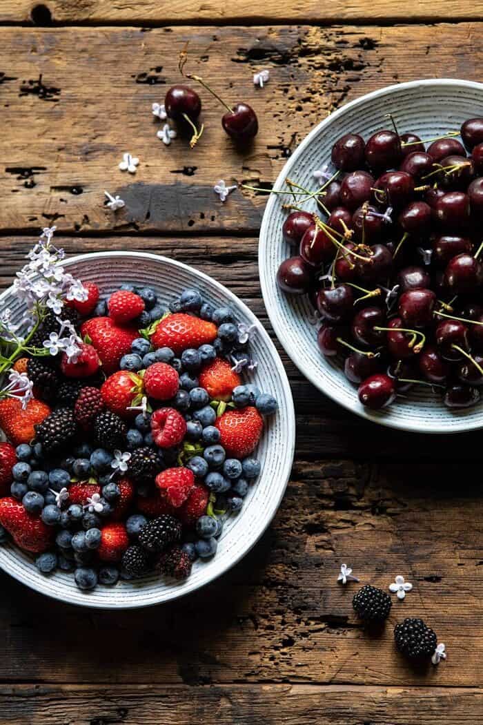 Buttery Cherry Berry Skillet Crisp | halfbakedharvest.com #berries #summerrecipes #easyrecipes #cherries raw cherries and berries in bowls