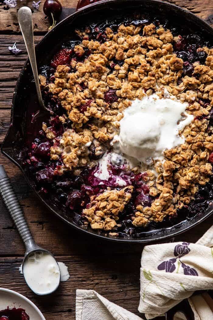 Buttery Cherry Berry Skillet Crisp | halfbakedharvest.com #berries #summerrecipes #easyrecipes #cherries overhead close up photo of Buttery Cherry Berry Skillet Crisp