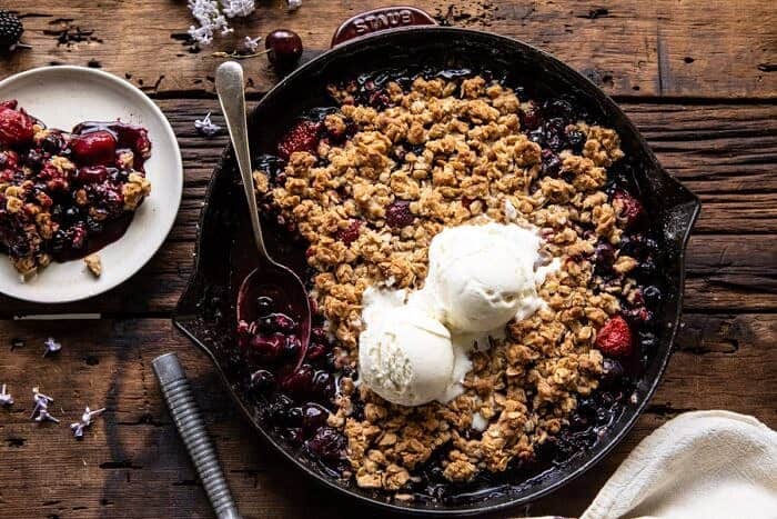 Buttery Cherry Berry Skillet Crisp | halfbakedharvest.com #berries #summerrecipes #easyrecipes #cherries horizontal photo of Buttery Cherry Berry Skillet Crisp