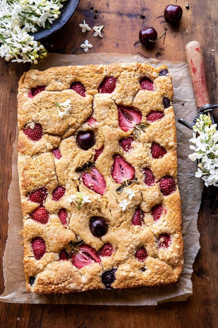 Cherry Strawberry Streusel Cake | halfbakedharvest.com #easyrecipes #cake #sheetcake #summerdessert overhead photo of Cherry Strawberry Streusel Cake before cutting