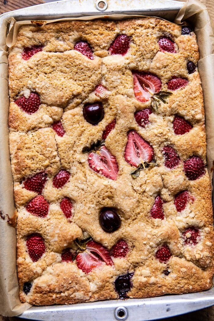 Cherry Strawberry Streusel Cake | halfbakedharvest.com #easyrecipes #cake #sheetcake #summerdessert overhead photo of Cherry Strawberry Streusel Cake in baking pan after baking