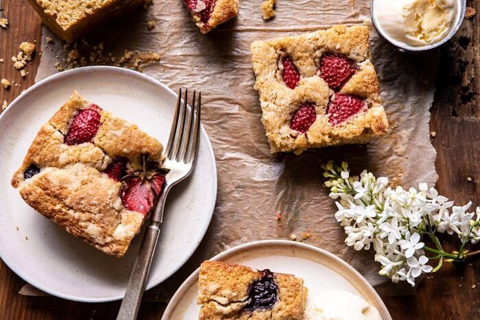 Cherry Strawberry Streusel Cake | halfbakedharvest.com #easyrecipes #cake #sheetcake #summerdessert horizontal photo of Cherry Strawberry Streusel Cake pieces